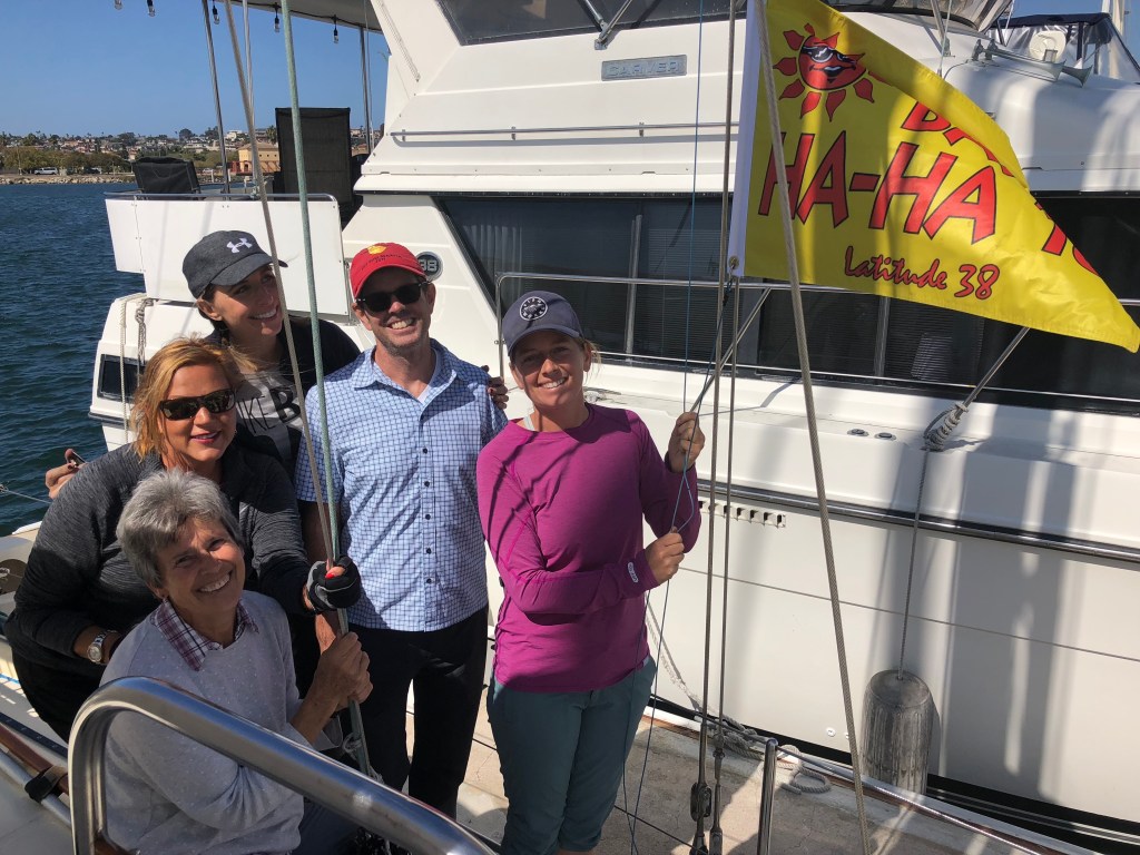 crew raises Ha-Ha burgee